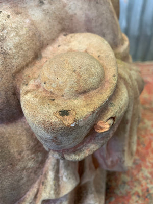 A large terracotta buddha statue