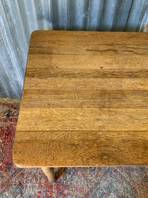 A Victorian oak table with single drawer