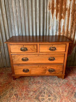 An Art Nouveau chest of drawers
