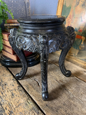 A small Chinese ebonised pedestal stand