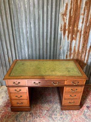 A late Victorian pedestal desk by Maple & Co