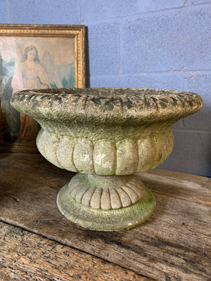 A pair of large cast stone gadrooned urns