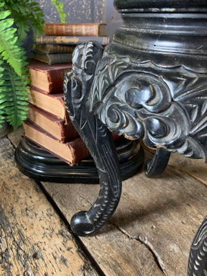 A small Chinese ebonised pedestal stand