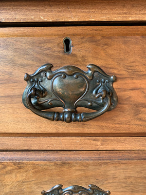 An Art Nouveau chest of drawers