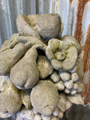 A cast stone cornucopia on plinth