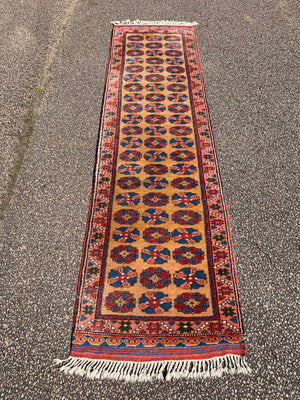 A long yellow ground red blue Persian runner rug ~ 257cm x 67cm