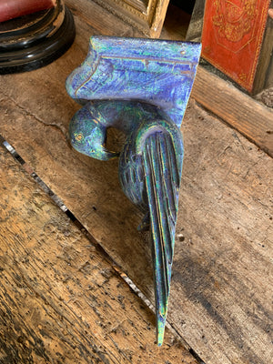 A pair of wooden corbels in the form of parrots