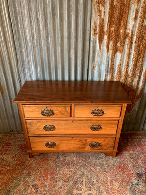 An Art Nouveau chest of drawers