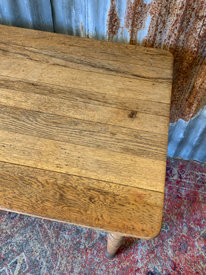 A Victorian oak table with single drawer