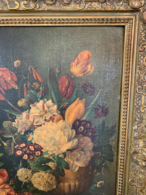 A framed floral oleograph