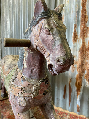 Carved wooden rocking horse