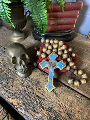 A set of oversized wooden rosary beads with eye motif