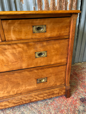 A satinwood chest of drawers
