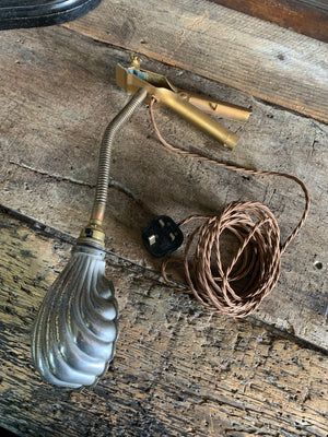 An Art Deco brass clip-on swan neck lamp