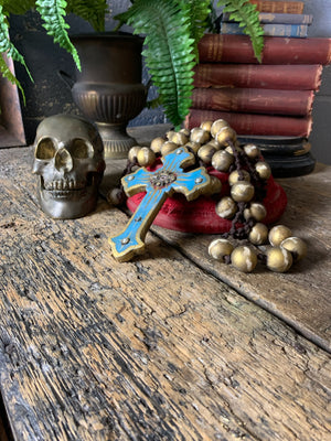 A set of oversized wooden rosary beads with eye motif