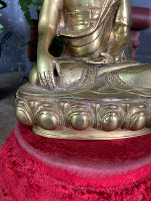 A bronze seated Buddha figure