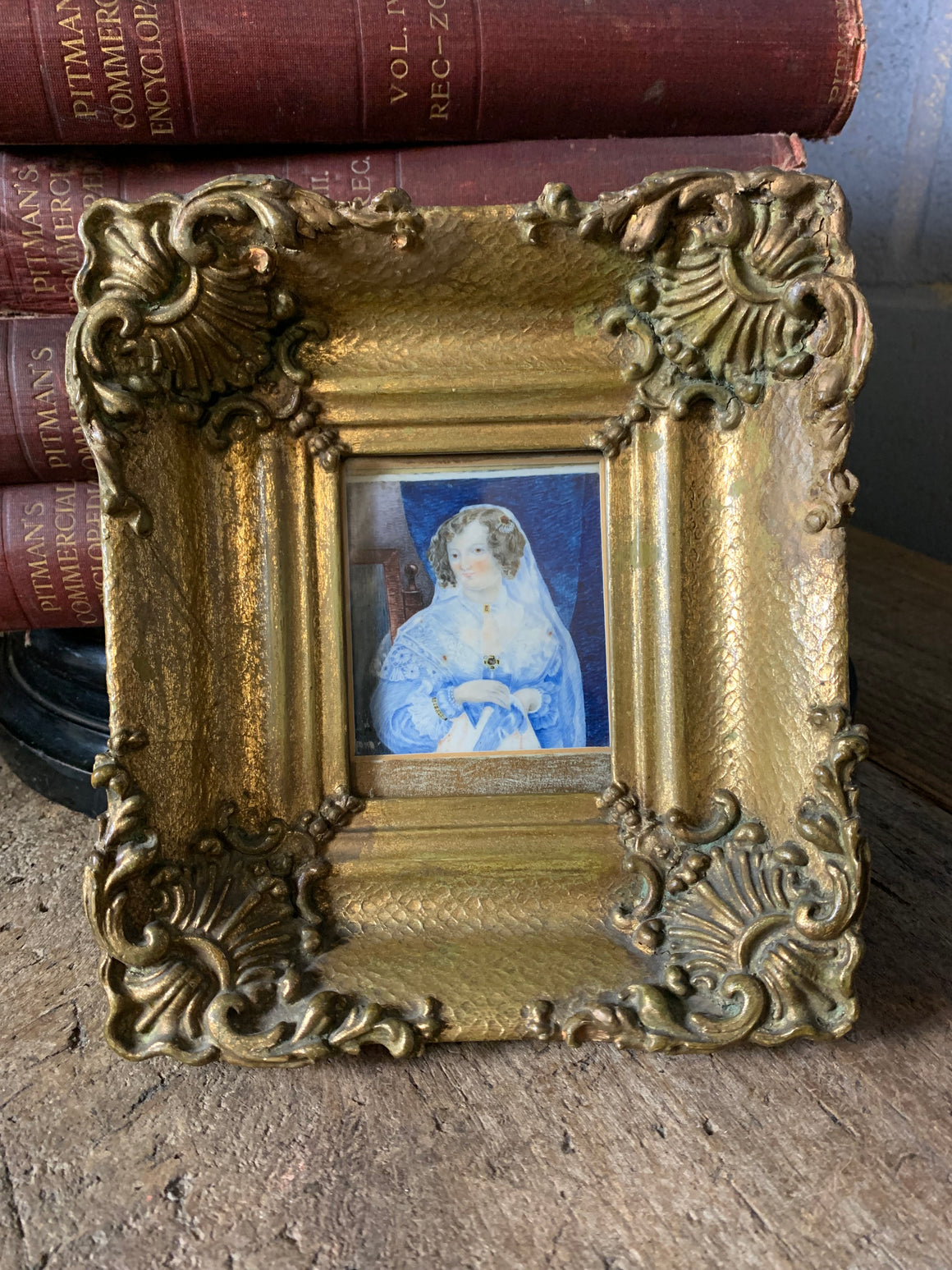 A framed miniature of a woman in blue ~ front view