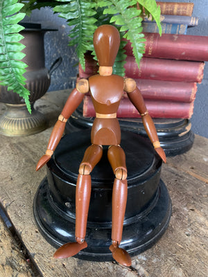 A two tone wooden artist's lay figure