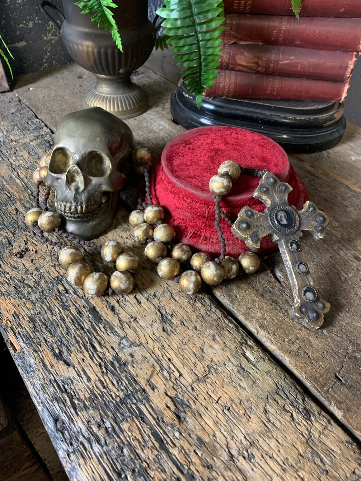 A set of oversized wooden rosary beads with memento mori motif