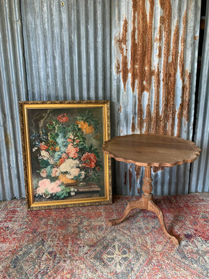 A Georgian style tilt top table with ball and claw feet