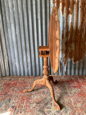 A Georgian style tilt top table with ball and claw feet