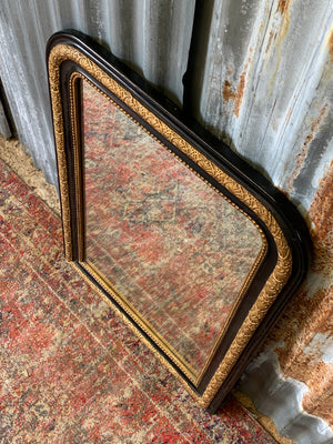 A large French black and gold mirror