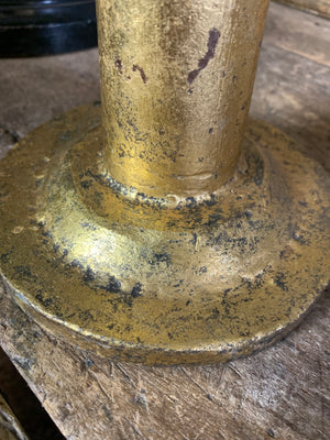 A gilt refraction candlestick with sunburst detail