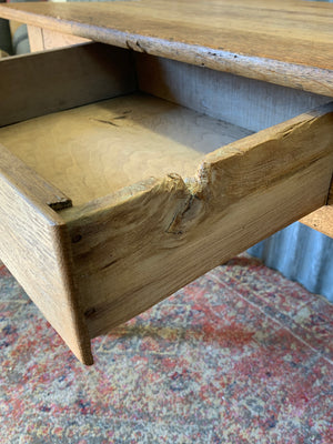 A Victorian oak table with single drawer