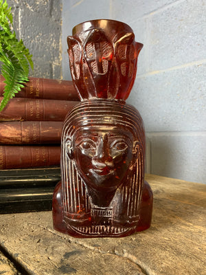 A carved bust of Tutankhamen in red Faturan