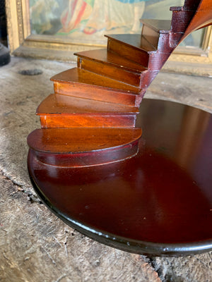 A wooden spiral staircase model