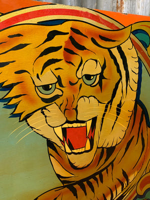 A hand-painted fairground panel depicting a tiger