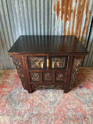 A carved wooden Chinese altar cabinet