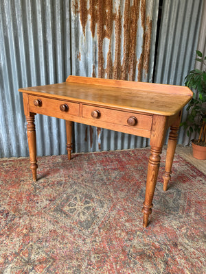 A pine two-drawer desk
