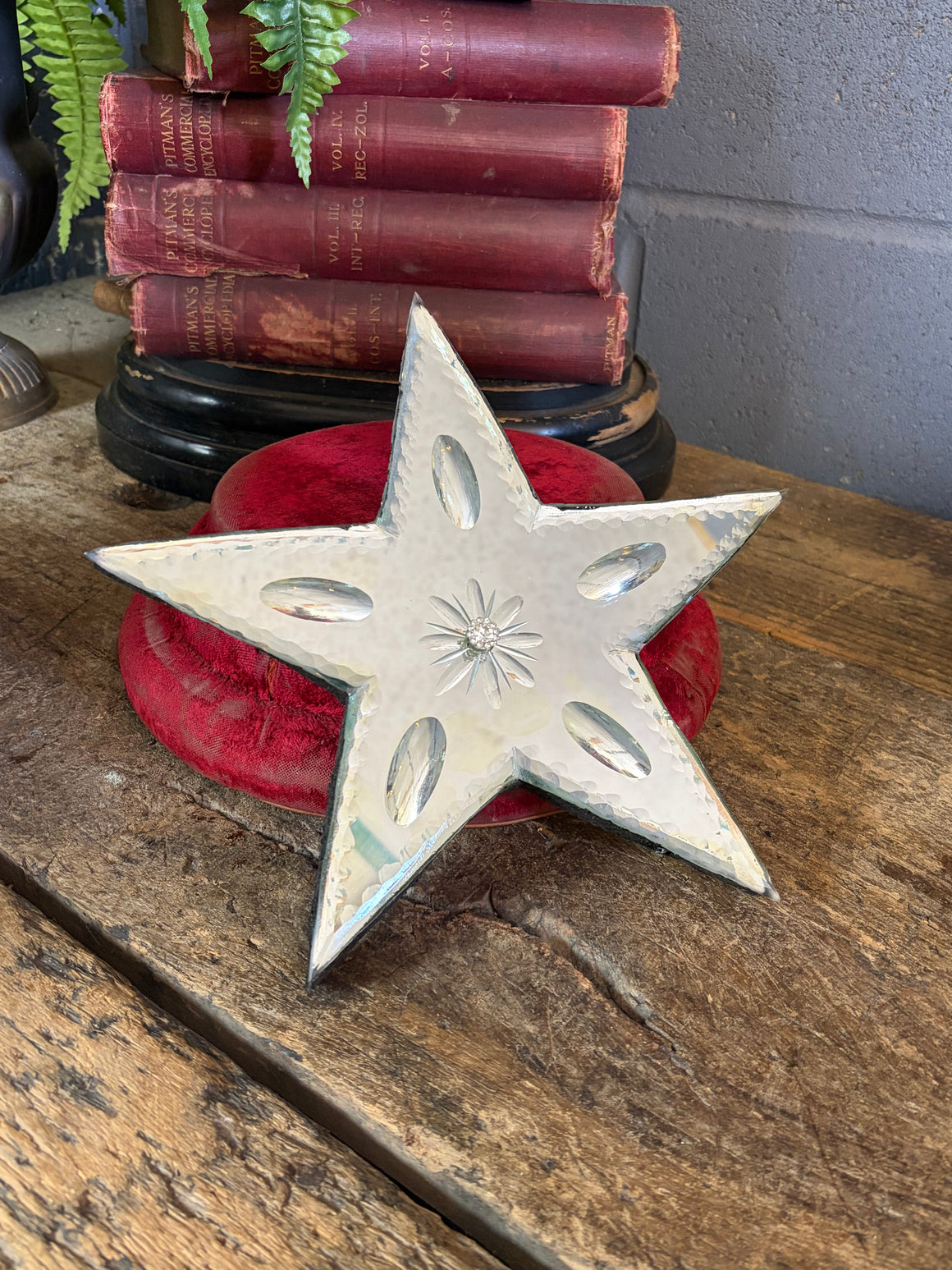 A Venetian-style mirror in the form of a star