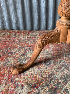 A Georgian style tilt top table with ball and claw feet