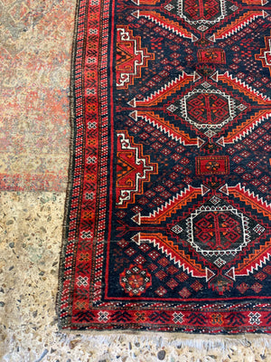 A Persian red & blue ground rectangular rug ~ 179cm x 96cm