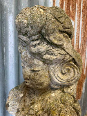 A cast stone garden statue of Guanyin