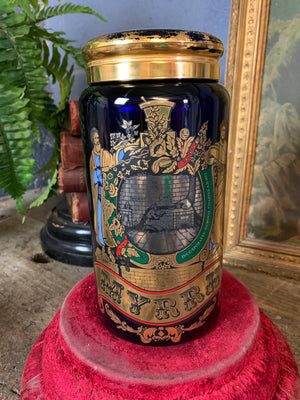 A blue glass myrrh apothecary jar by the Royal Pharmaceutical Society