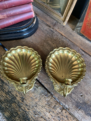 A pair of large brass shell candlestick wall sconces