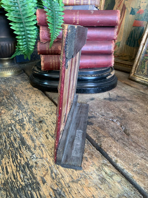 A wood and leather book spine hideaway panel ~A