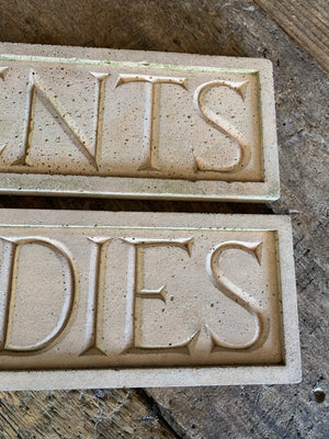 A pair of cast stone plaques ~ "LADIES" & "GENTS"