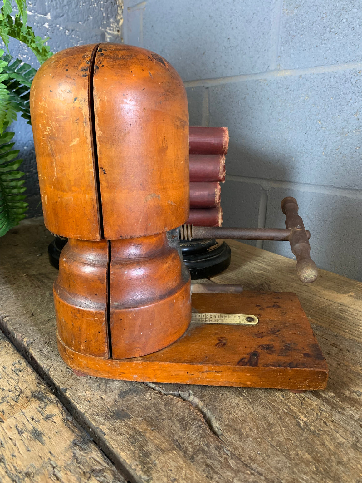 A wooden millinery hat stretcher