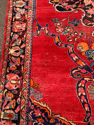 A very large rectangular red ground Persian floral rug ~ 12ft x 8ft