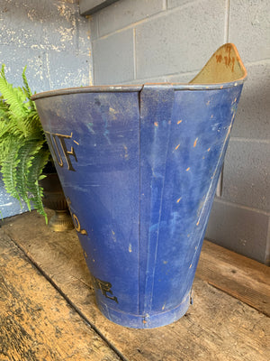 A large metal grape hod