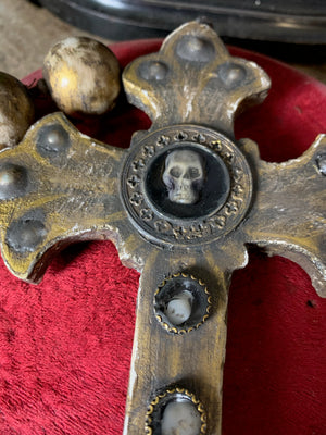 A set of oversized wooden rosary beads with memento mori motif