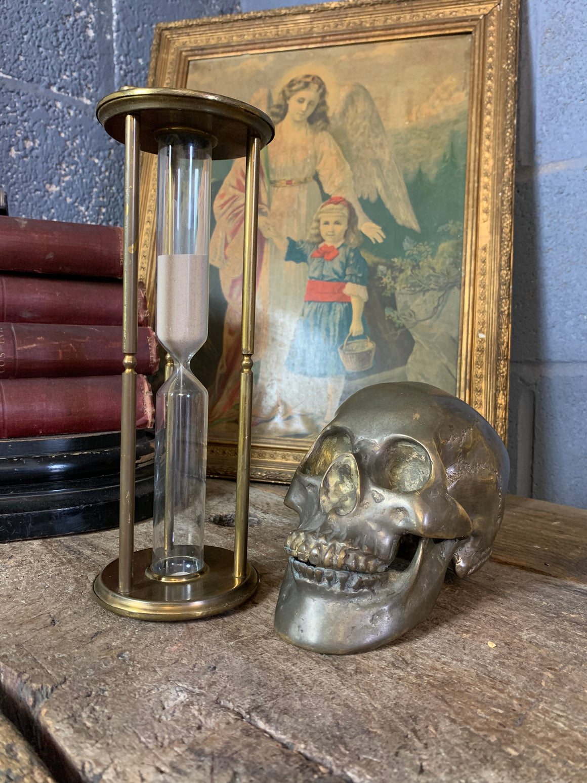 A tall brass hourglass