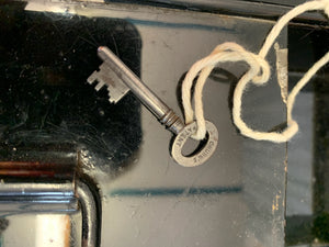 A Victorian black metal strong box with lock and key