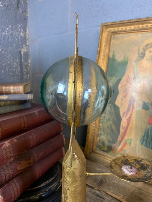 A gilt refraction candlestick with sunburst detail