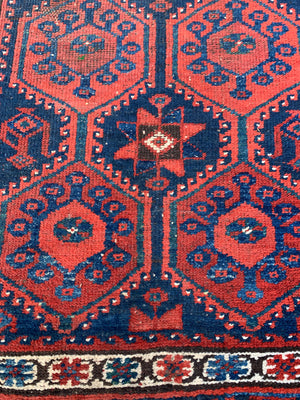 A long red ground blue Persian runner rug ~ 304cm x 104cm