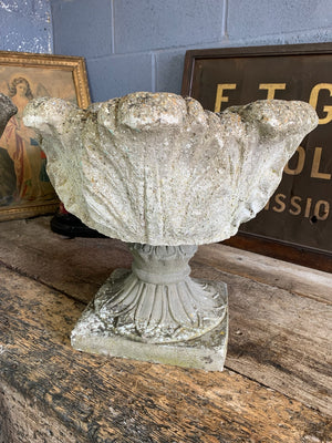 A pair of large acanthus cast stone urns